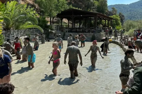 Tourists enjoying the natural mud bath in Dalyan Marmaris.