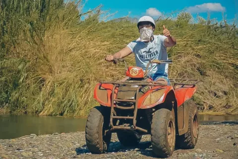 Happy holidaymakers posing with their quad bikes during a thrilling off-road safari experience in Marmaris.